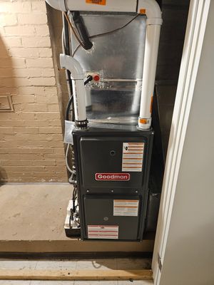 New Goodman gas furnace installed in a home utility closet