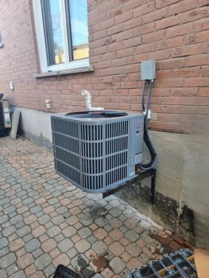 Carrier central air conditioner installed on a paver patio