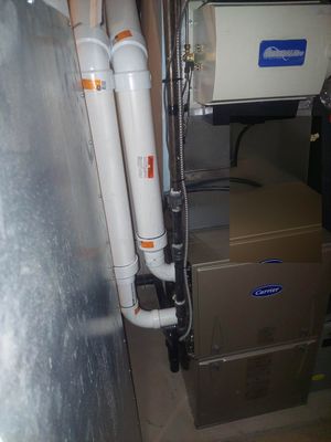 Carrier furnace with GeneralAire humidifier installed in a basement
