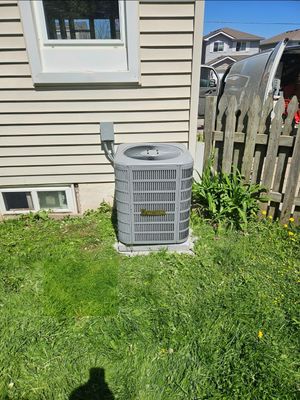 Trane central air conditioner installed in a backyard